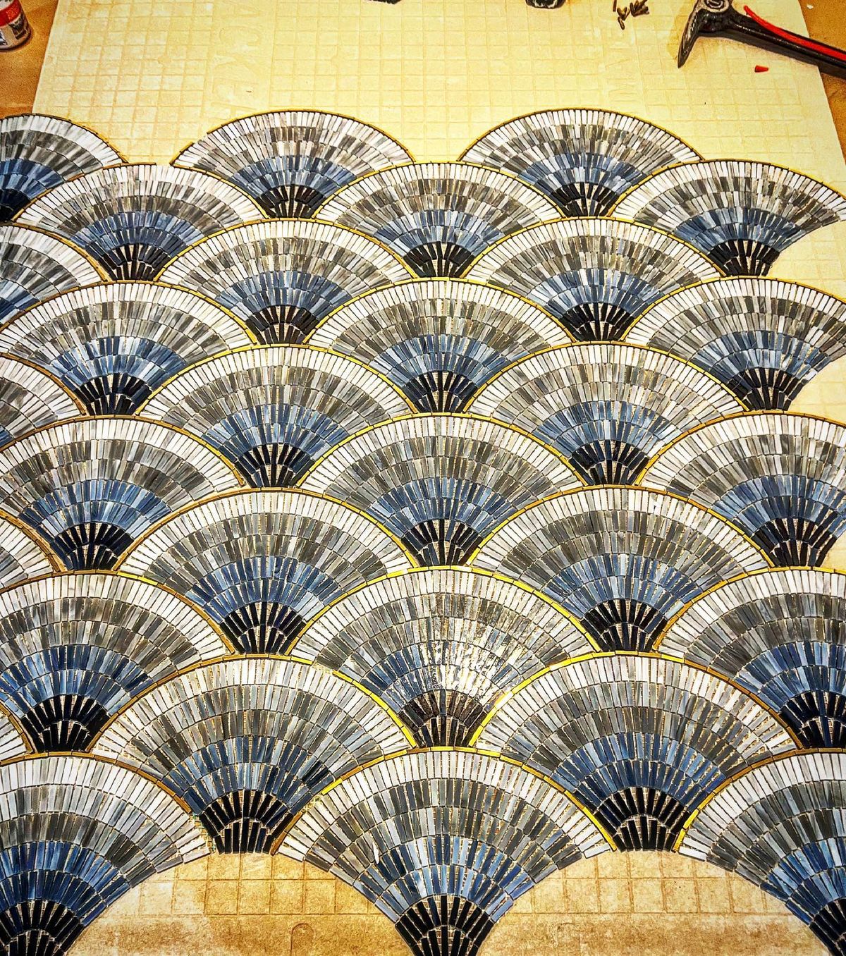 Custom mosaic fan pattern tile work showing expert craftsmanship